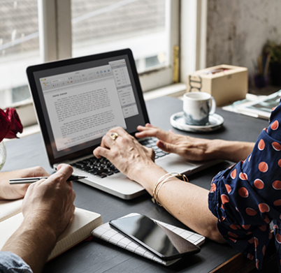 Woman Working on Laptop Typing Essay Information